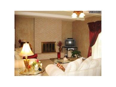 Great room with woodburning fireplace and patio do