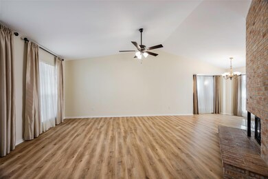 First view of unfurnished living room featuring ne
