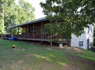 Back of house with full length covered porch to enjoy those peaceful country evenings!