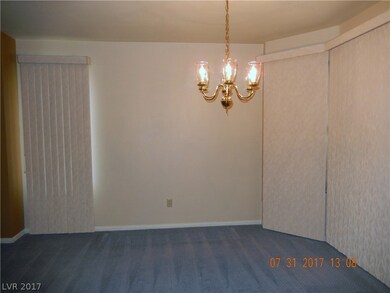 Formal dining area has upgraded chandelier.