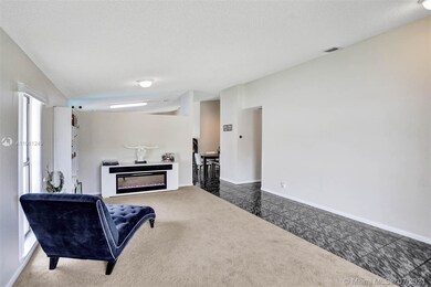 Living room. The opening to the right is to the be