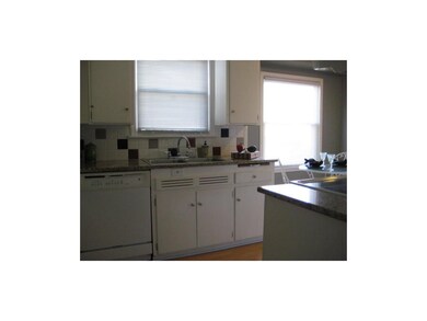 Kitchen With Gleaming Granite Counter Tops