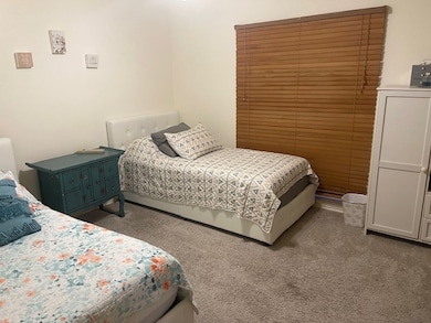 Bedroom featuring carpet