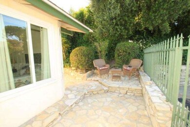Raised sitting area off of front courtyard