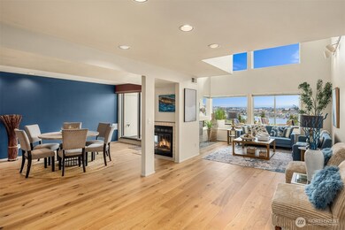 The grand, recently opened living space is designed for large gatherings, all capturing the incredible views centered around two main-floor wood-burning fireplaces, new Australian solid hardwood floors, triple-glazed storm/sound-proof/resistant windows, and all open to a full-length deck overlooking Thomas Wales Park and Lake Union. July 4th, here we entertain!