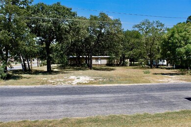 Abundant mature trees & utilities on site.