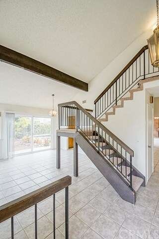 Living room with stairs to loft area