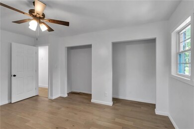 Unfurnished bedroom with light wood-style flooring