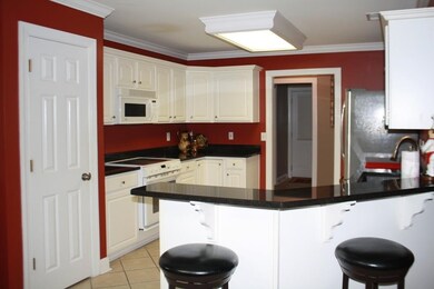 Kitchen is spacious w pantry, plenty of cabinets, granite and tile.