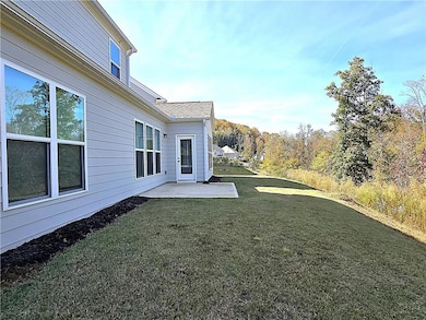 View of grassy yard with a patio