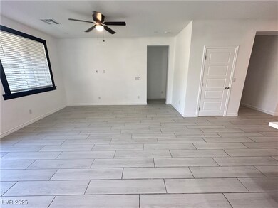 Unfurnished room featuring ceiling fan and baseboa