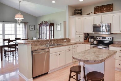 Beautiful kitchen with a center island opens to th