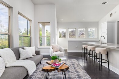 Living room featuring baseboards, dark wood-style