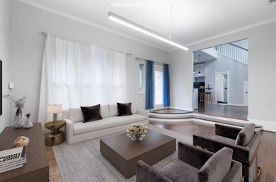 Living room with wood finished floors and ornamen