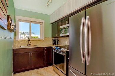Remodeled kitchen with granite countertop.