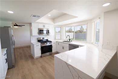 Kitchen featuring appliances with stainless steel