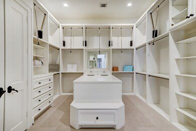 Dreamy primary closet with 3rd level movable racks