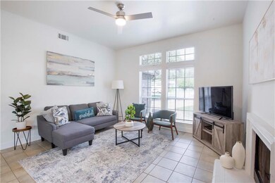 Living area featuring light tile patterned floori