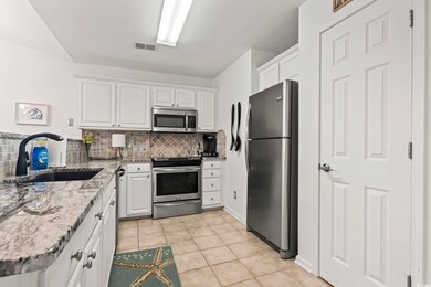 Kitchen with appliances with stainless steel finis