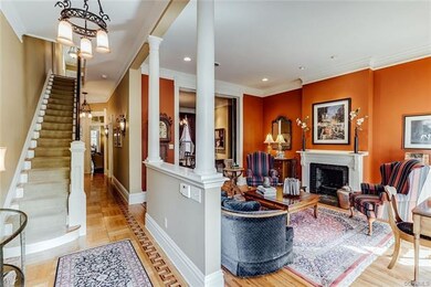 Foyer opens to Living Room flanked by two columns.