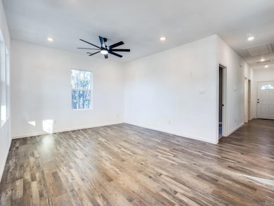 Unfurnished room with visible vents, baseboards, a