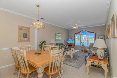 Dining room featuring carpet, ornamental molding, 