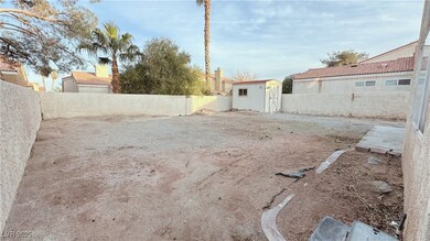 View of yard with a storage unit