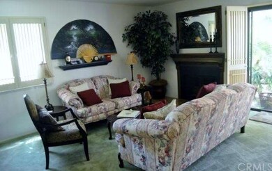 Living Room with plantation shutters and sliding d