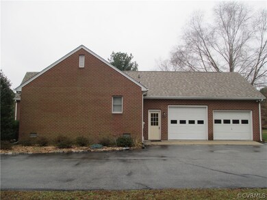 Right side of house with side load 2 car garage