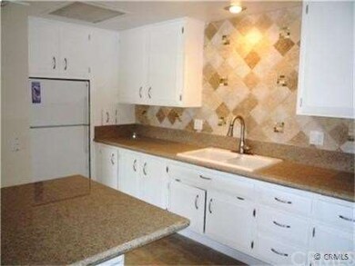 View of Kitchen toward Refrigerator