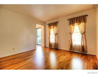 Formal living room with natural light, hardwood fl