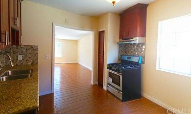 Kitchen opens up into rear recreation/romper room.