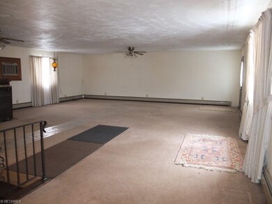 Spacious family room with wood burner.
