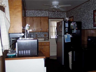Kitchen. Newer stove, refrigerator door leads to a