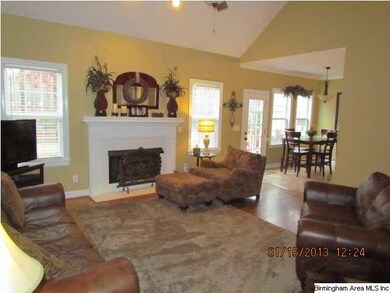 Family room offers gleaming hardwood flooring and 