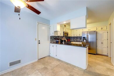 Breakfast nook off kitchen.  Garage door access.