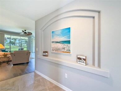 Corridor featuring baseboards and light marble fin