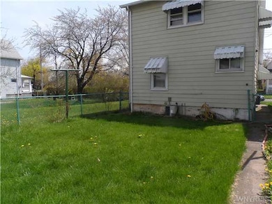 Backyard Photo of back of house and yard from the 