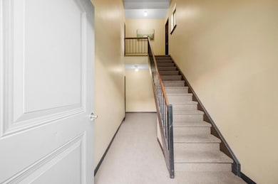 Staircase featuring baseboards