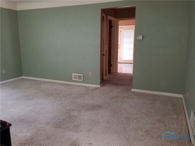 Living room has cove ceilings