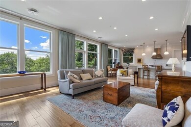 Light filled living room open to the kitchen