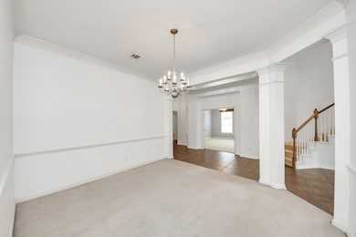 The formal dining room features a warm, inviting a