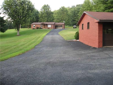 Exterior Front. Paved Driveway