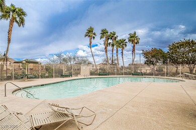 Community pool featuring a patio