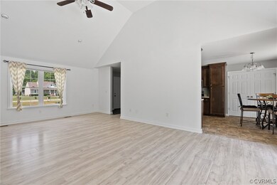 Living room featuring high vaulted ceiling, ceilin