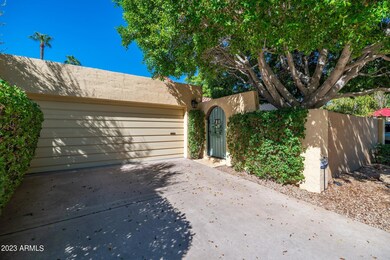 Front of home w garage & coutyard door