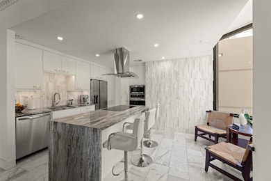 This kitchen embodies a sleek and contemporary des