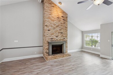 Living Room Features Wood Burning Fireplace