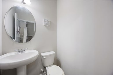 Half bath with a sink and toilet