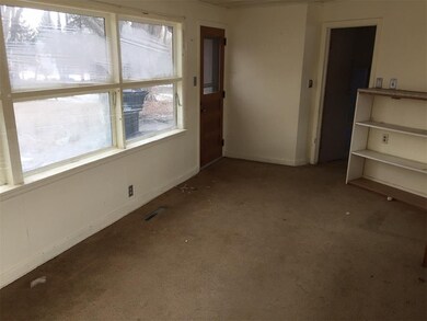 Enclosed breezeway between house and original gara